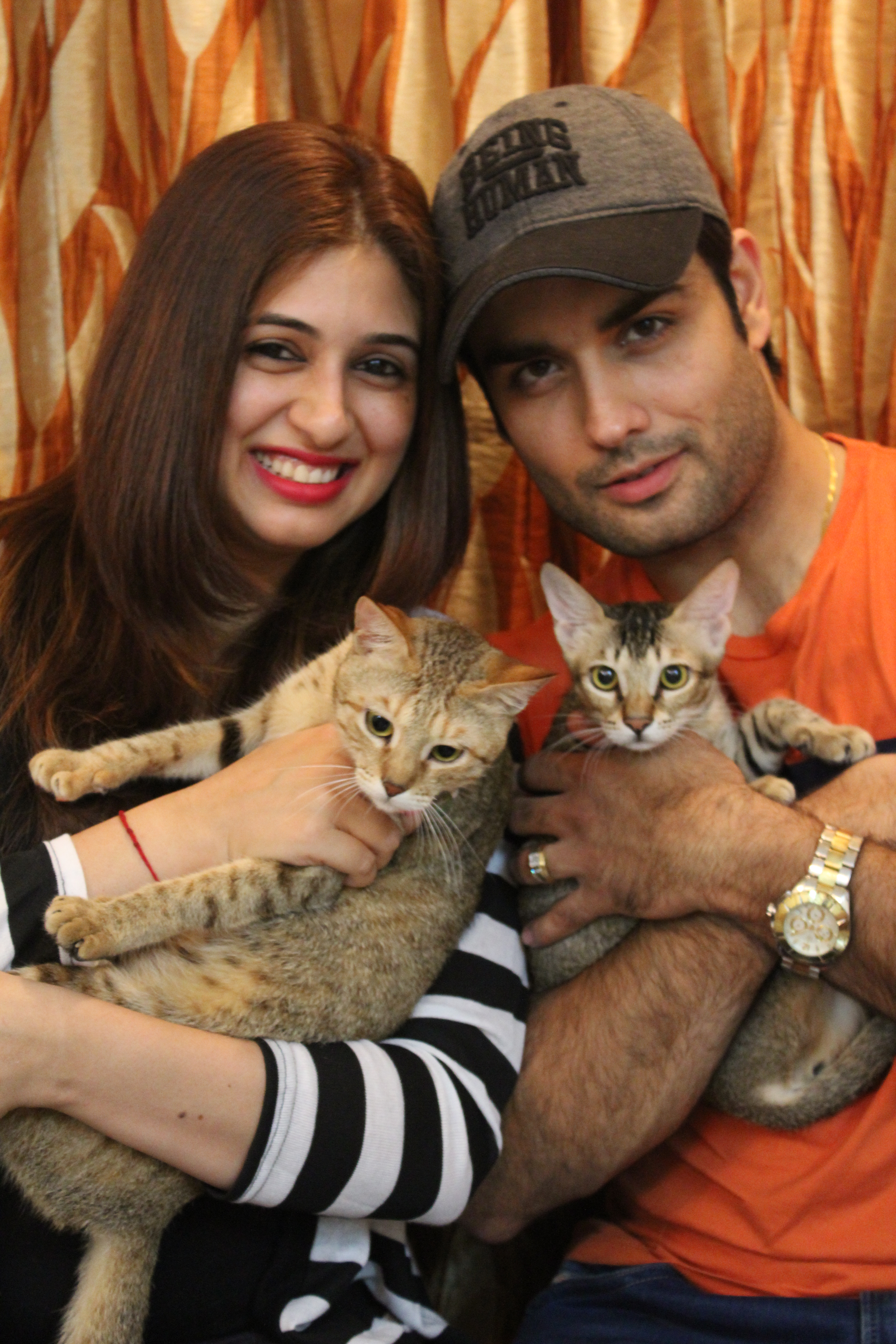 Vivian and Vahbbiz with cats